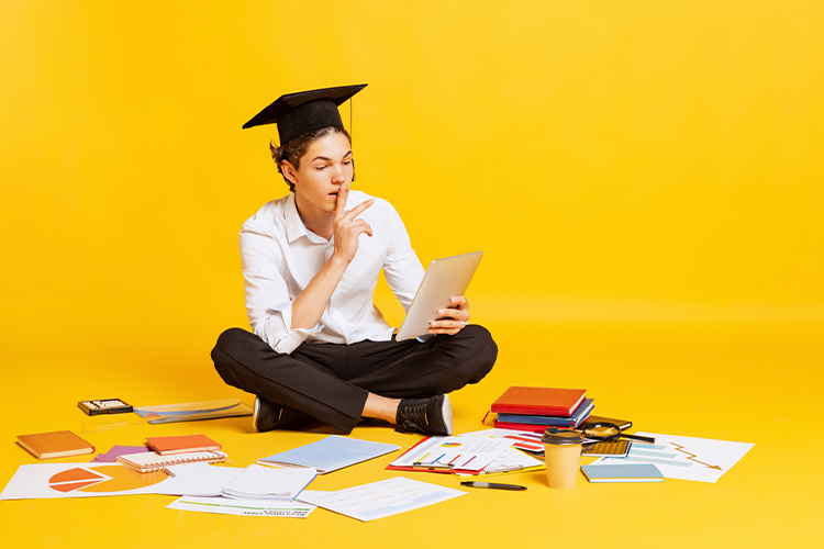 a male learner looking at online accredited university options