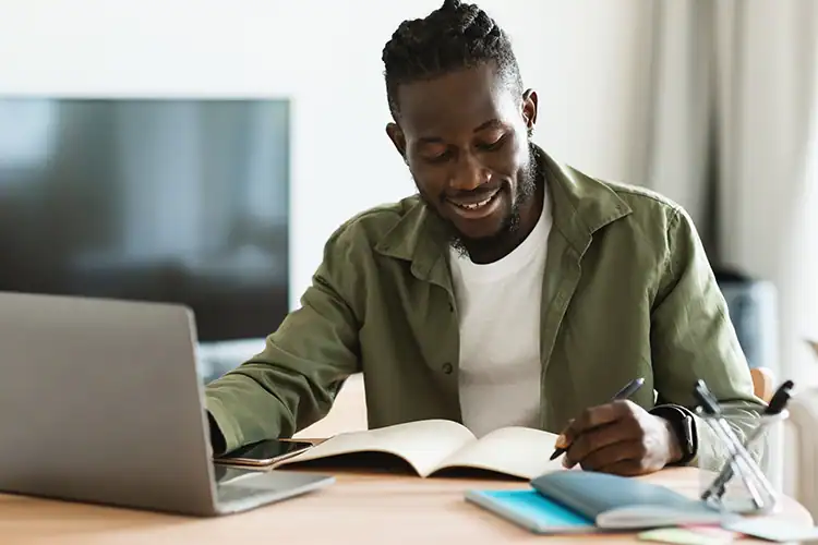 a male online MBA learner