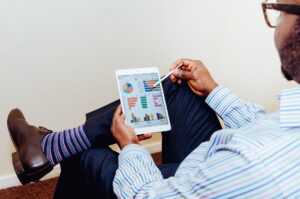 Accountant reviewing data analysis on tablet