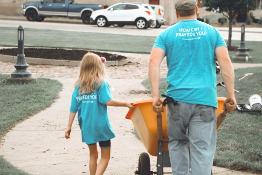 Father and daughter volunteering in their community