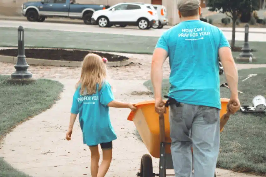 Father and daughter volunteering in their community
