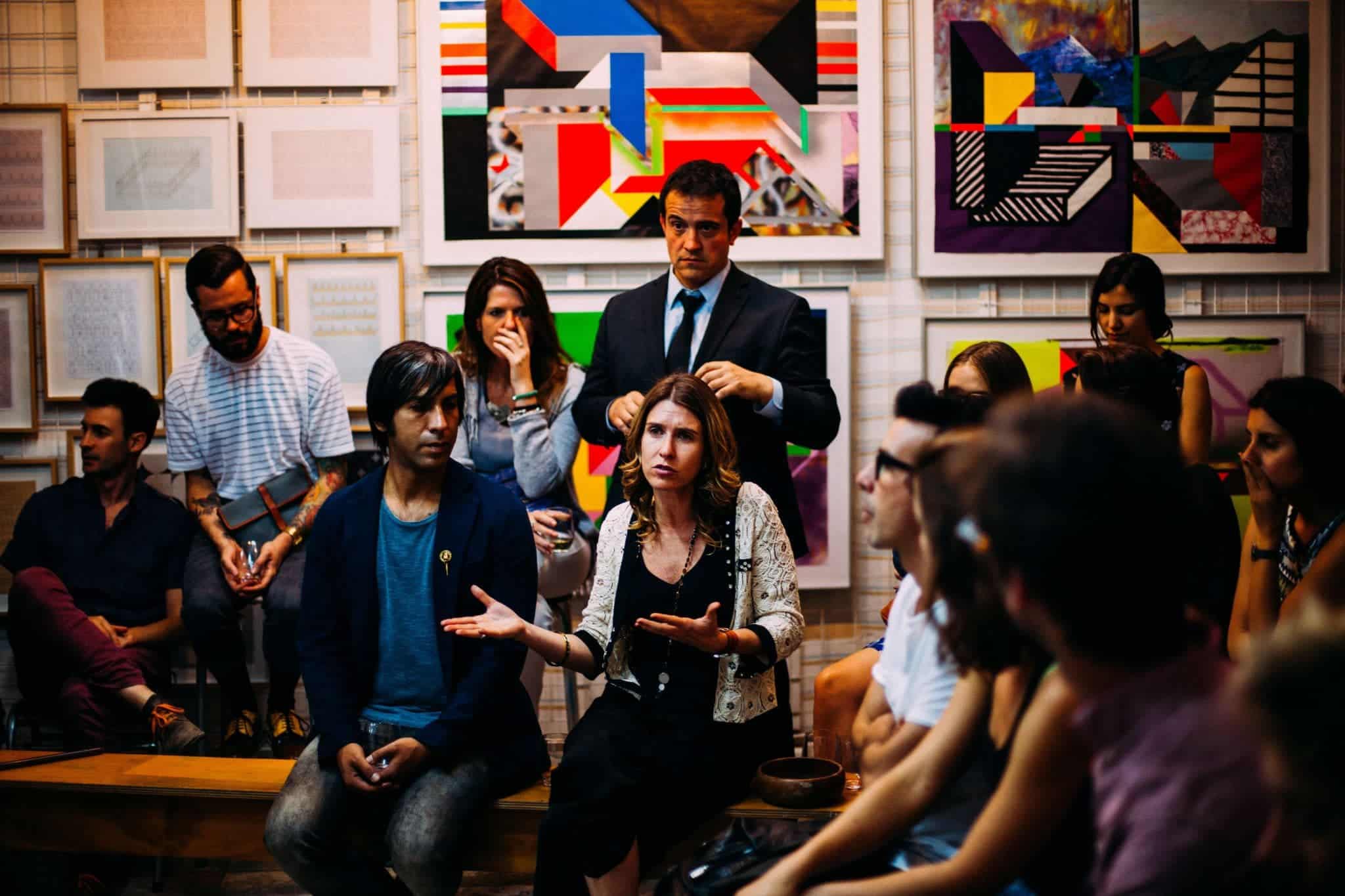 Woman speaking in front of others in a discussion