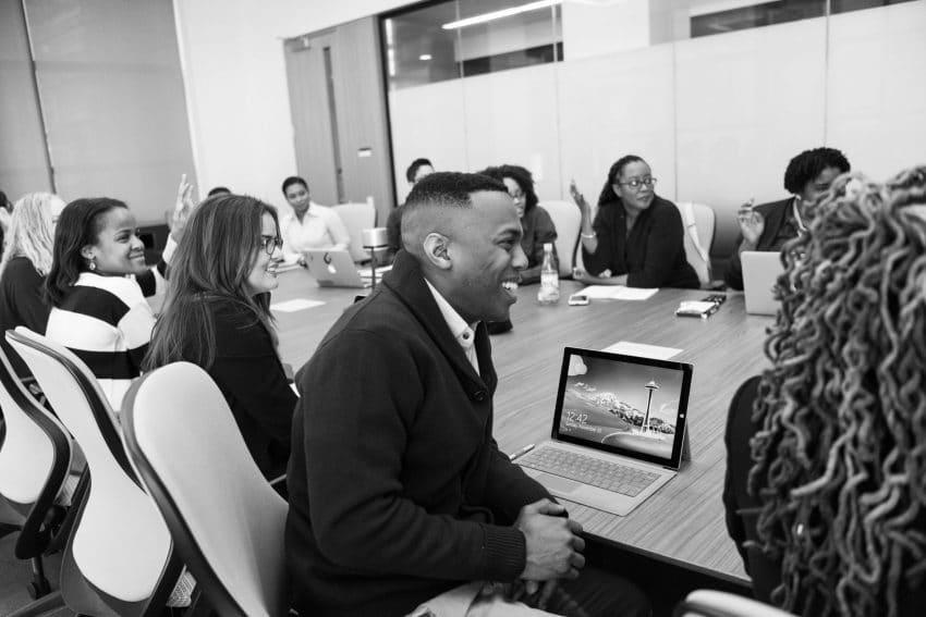 Service learning students in a meeting