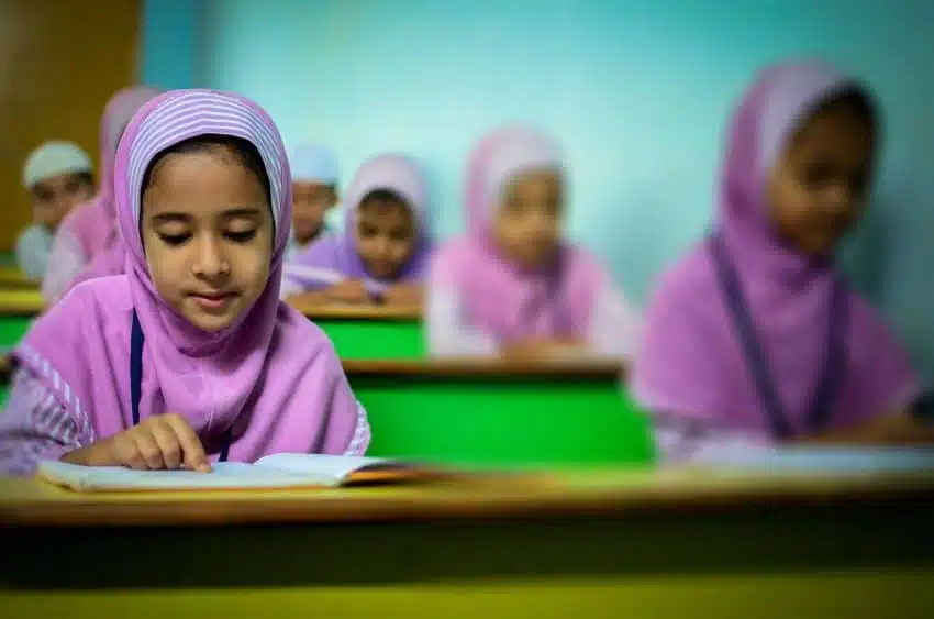 Female students sitting at desk during think-pair-share activity