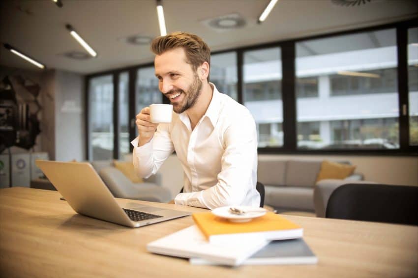 Person drinking coffee at work