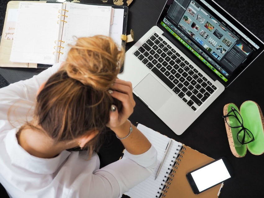 A college student completely swamped with homework.