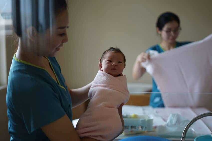 Nurse holding baby