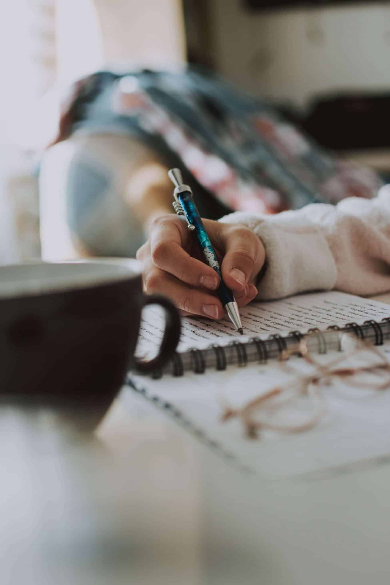 Person writing in a notebook