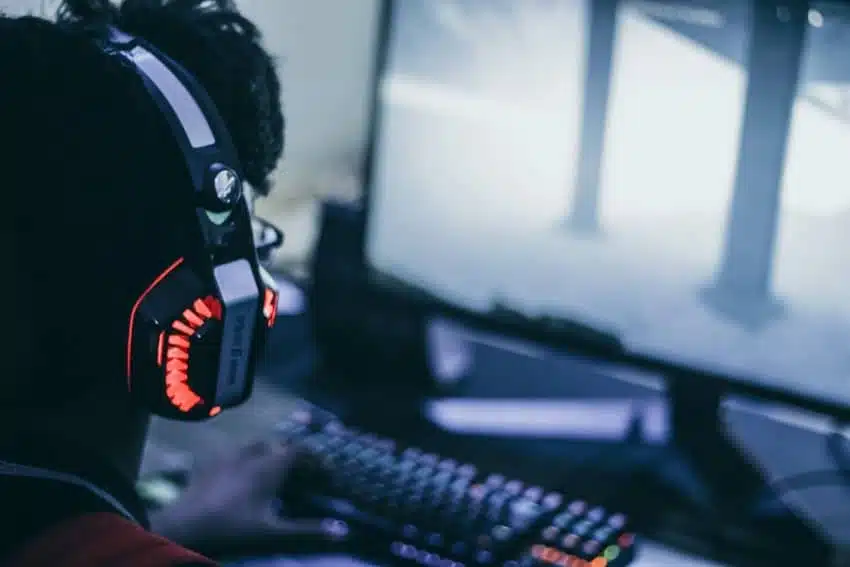 Unity game developer creating a game on a computer