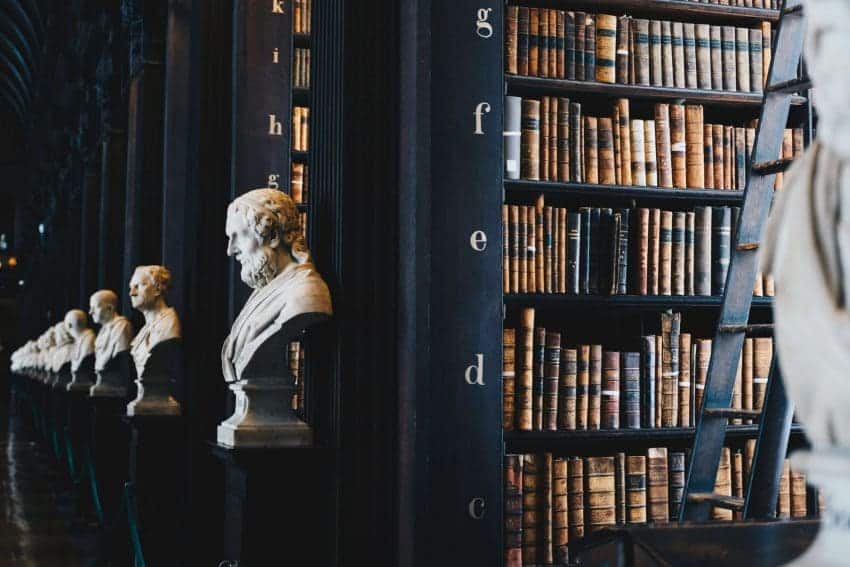 Statues and bookshelves filled with books