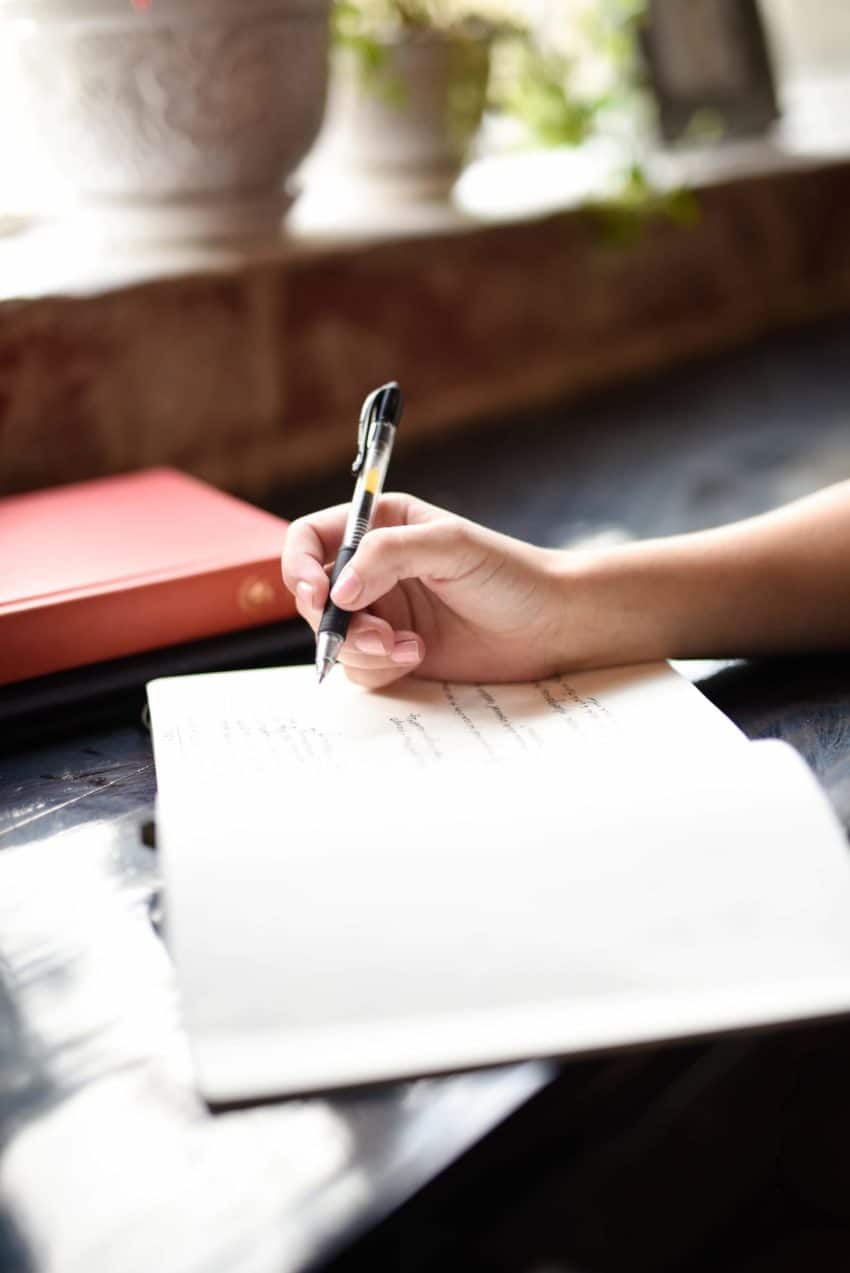 Person writing in a journal