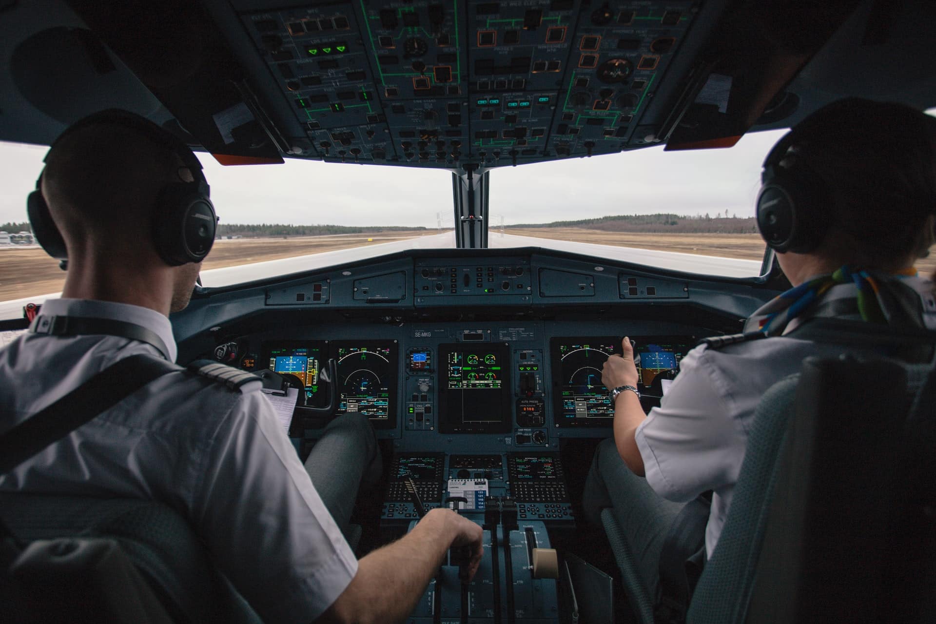 Pilots in the cockpit flying a plane