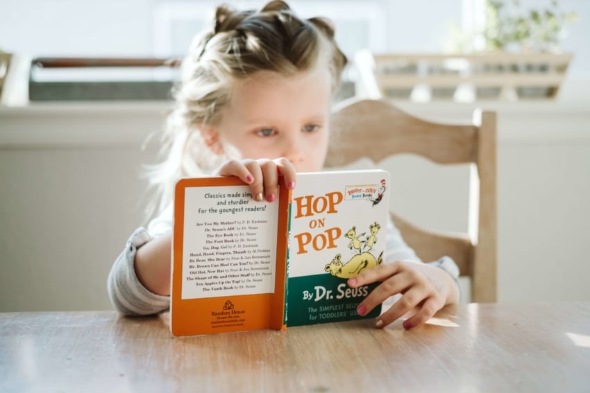 “Young child reading a book”