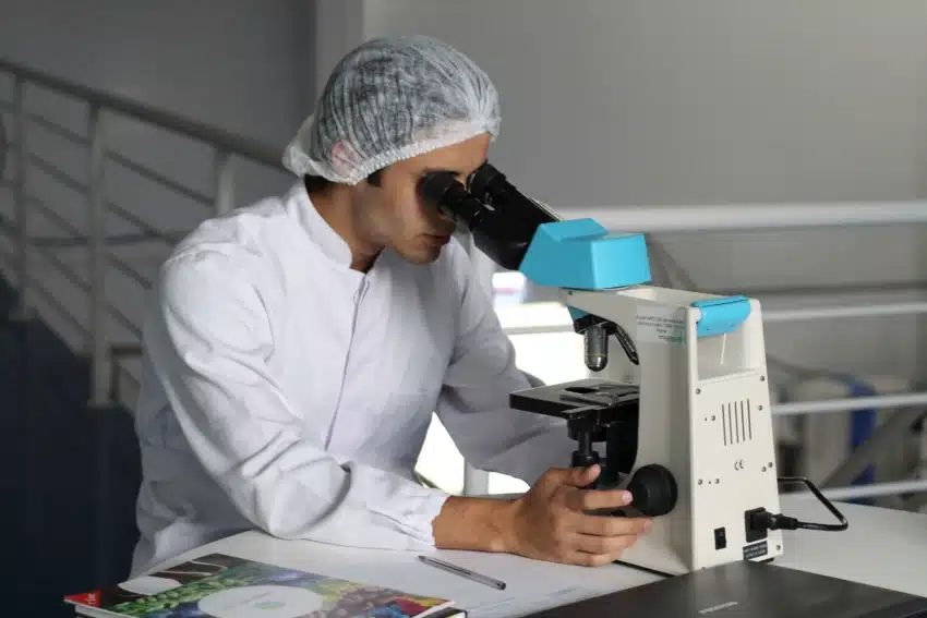 Man looking in microscope