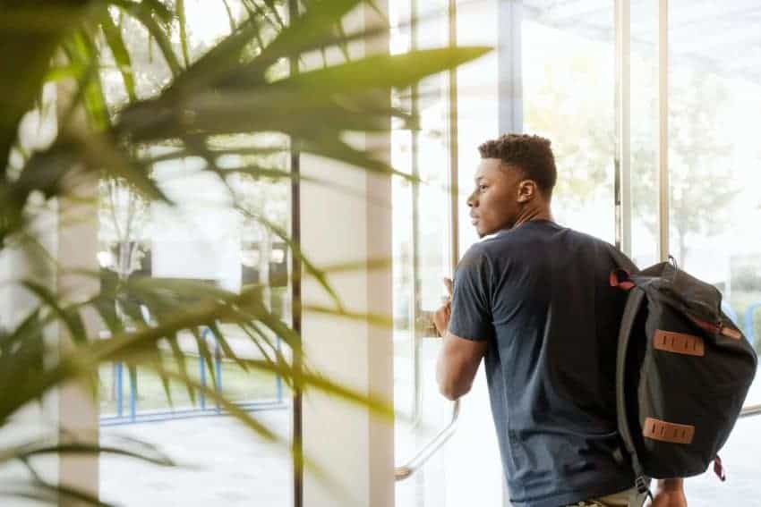 Student with backpack skipping class