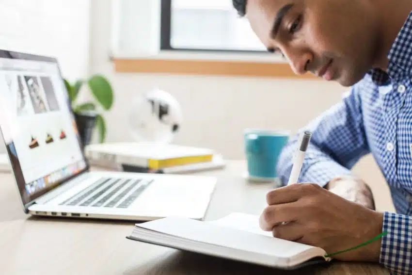 learn hand writing A male student at the University of the People practicing shorthand.