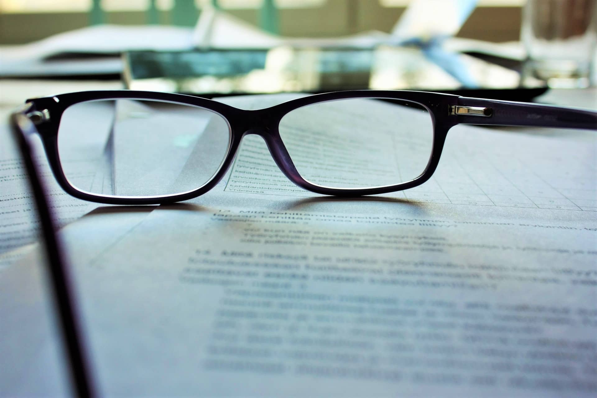 Glasses on top of legal research for public policy job