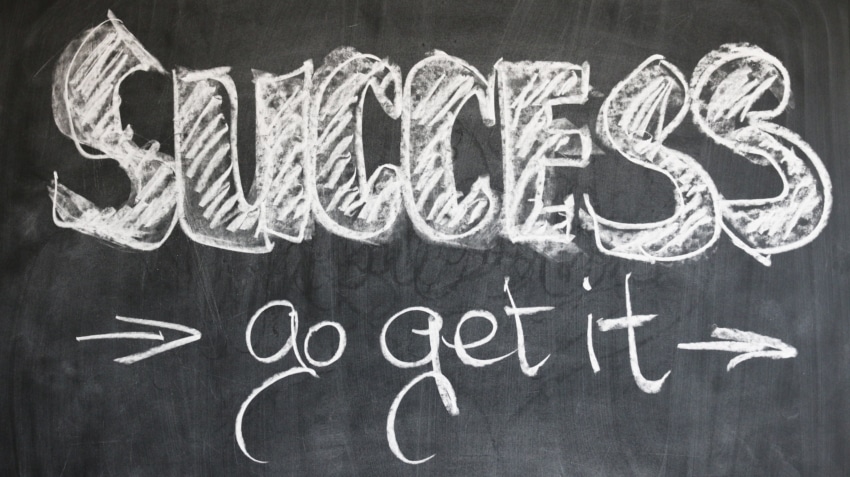 Blackboard with message about success