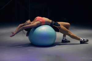 woman using ball for physical therapy