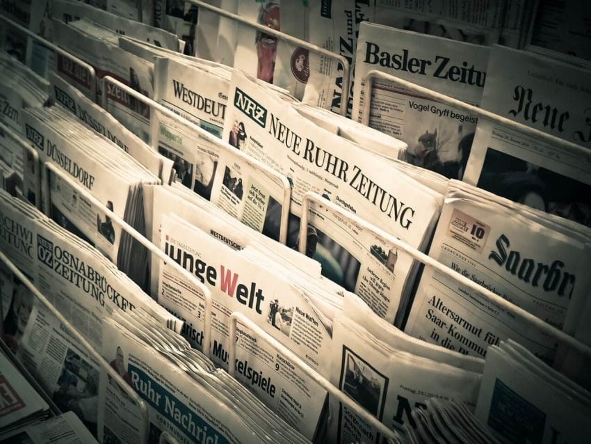 A display of newspapers at a newsstand