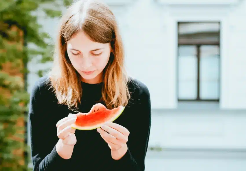 Student holding watermelon stress-free before a test