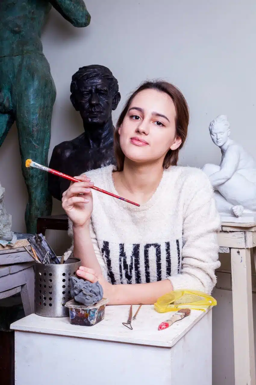 Female artist holding a paintbrush