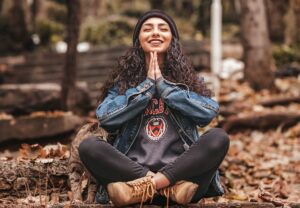 Young woman performing mediation as part of behavioral medicine practice