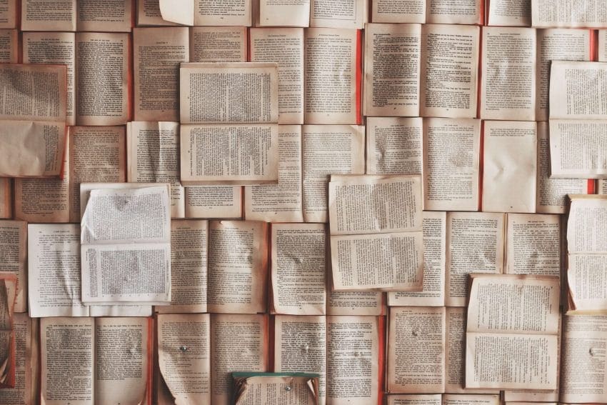Open books with text possibly containing italicized text