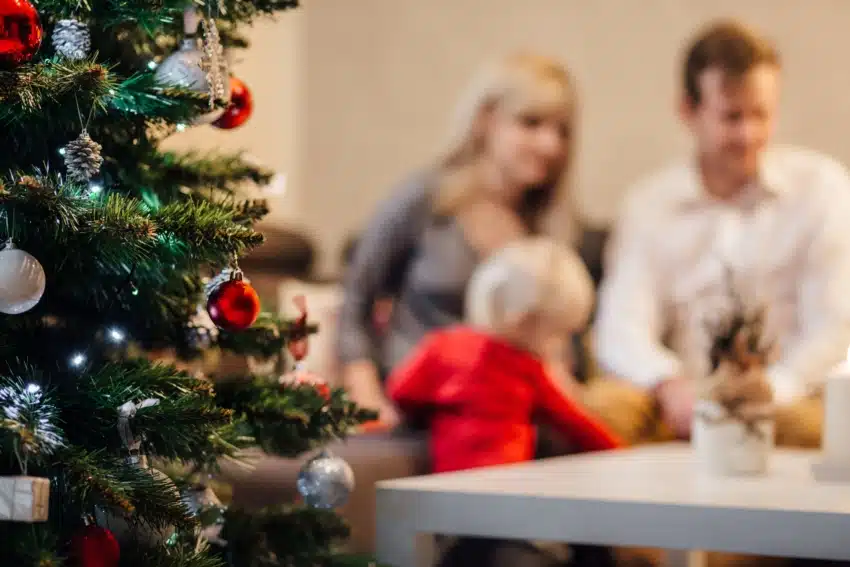 essay on family holiday Parents celebrating Christmas with their child