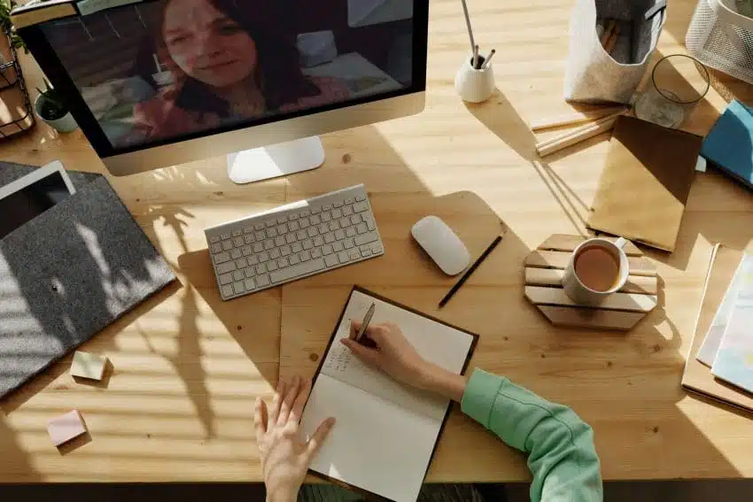 Student attending lecture at home office