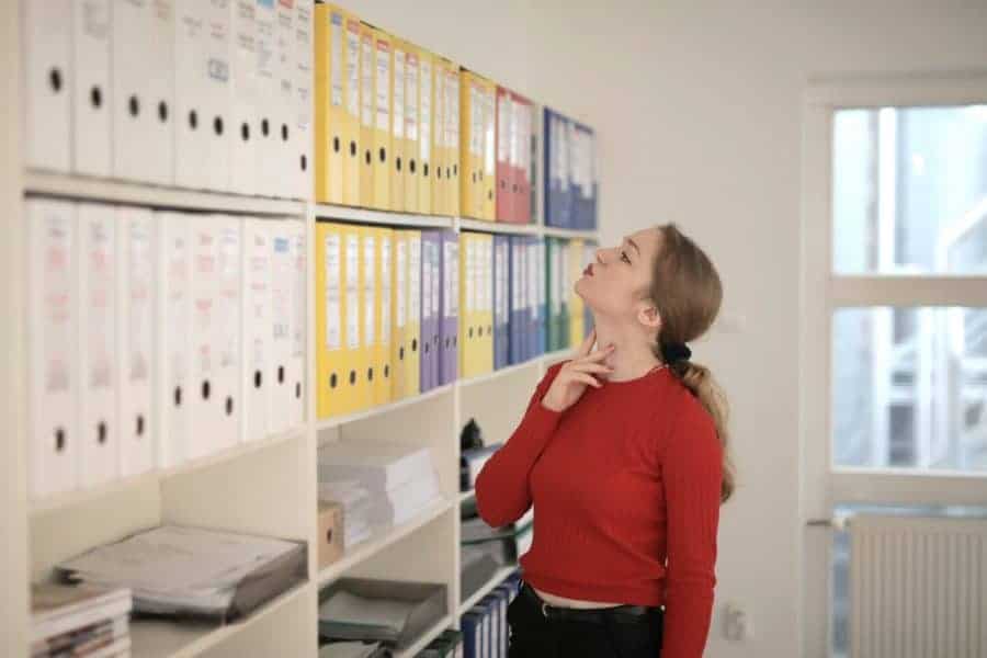 female healthcare administrator looking at files