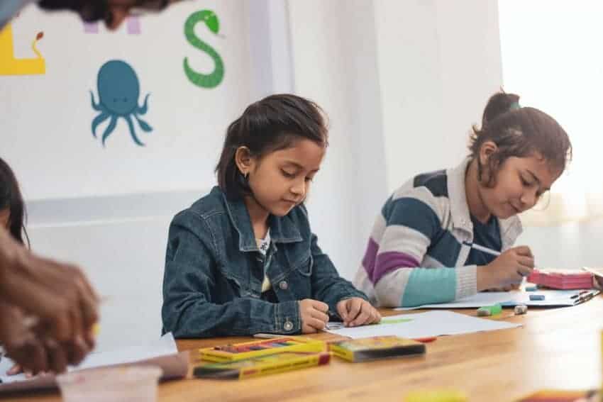 Two young students in school participants in federal TRIO programs