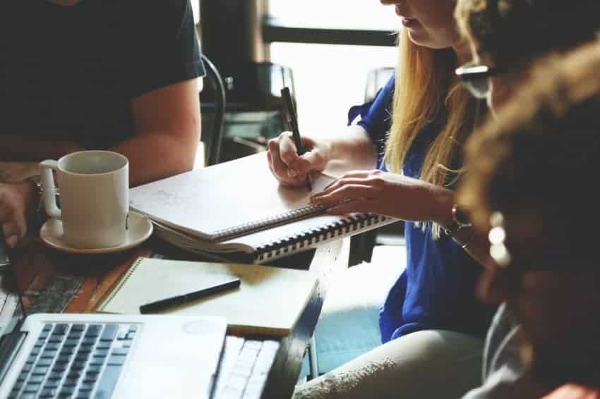 Teaching grading a student’s work at a cafe