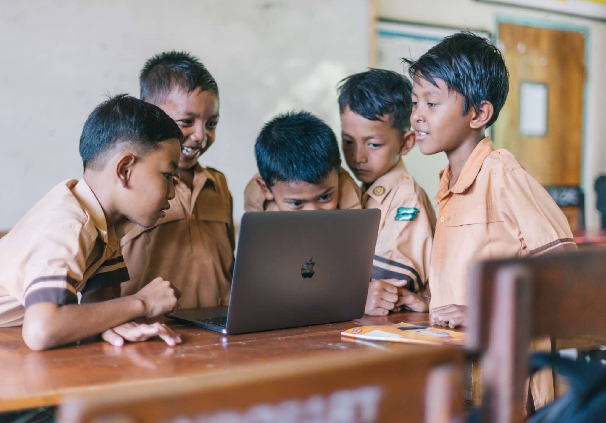 Group of young boys learning to code