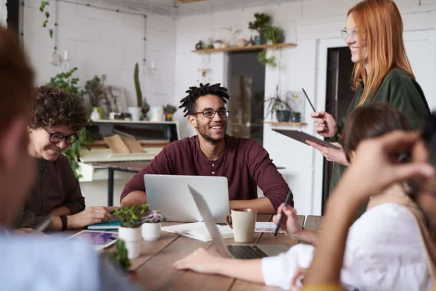 “Students chatting after sharing opinions in a discussion with other students”