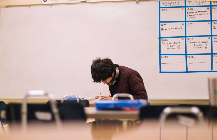 A graduate student intensely preparing for his comprehensive exam