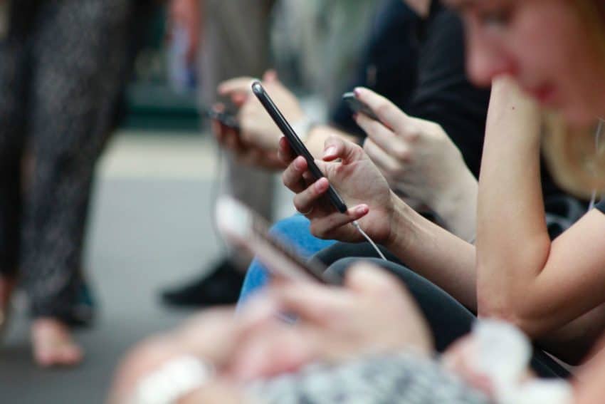 Young group of people on cell phones