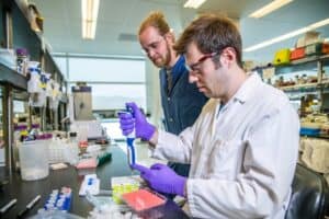 two men in a lab conducting an observational study