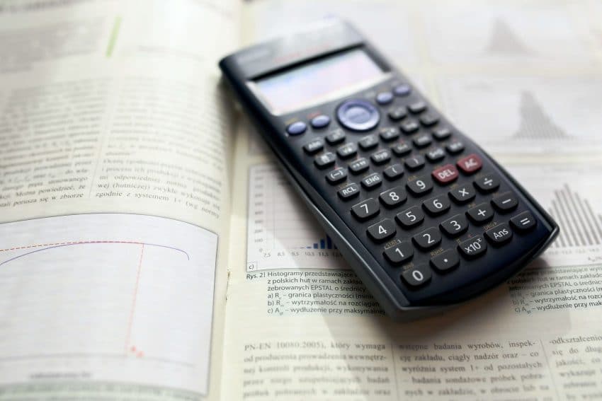 Calculator on top of an open book