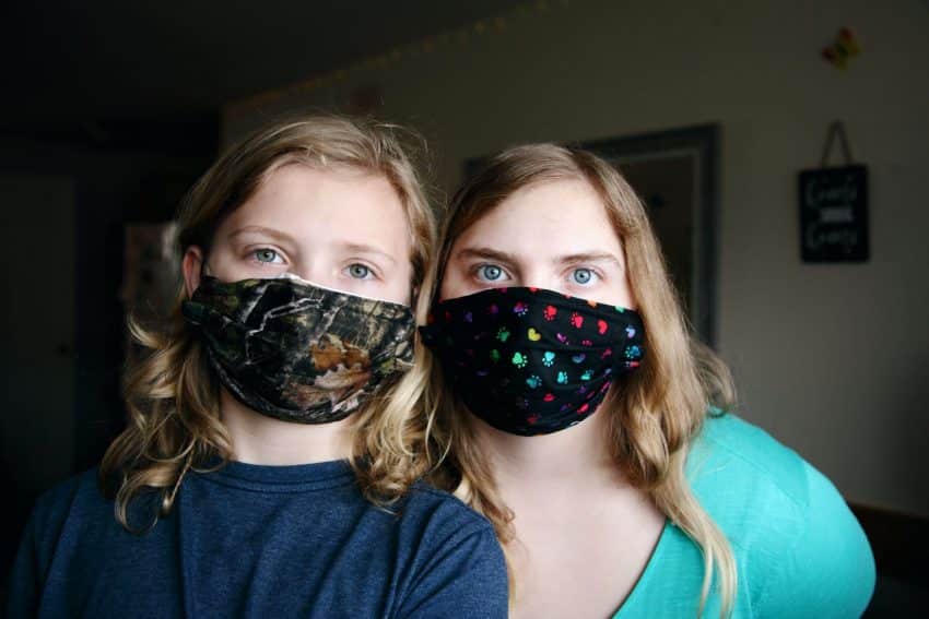 Mother and daughter wearing masks to protect from coronavirus