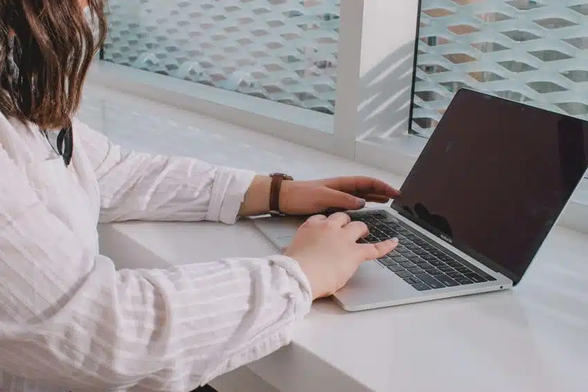 Parent helps child navigate his classes online