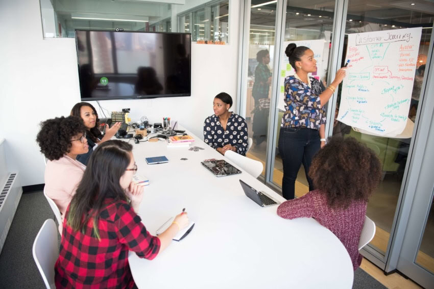 College students study in a university classroom that pays them to attend.