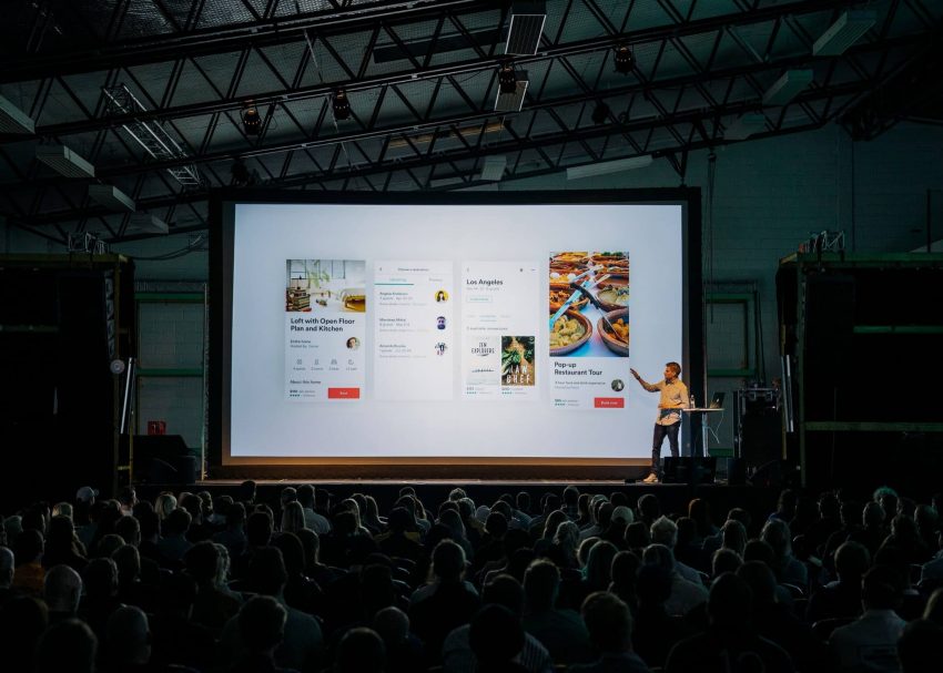 Student presenting in large college classroom