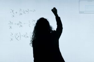 woman writing equations