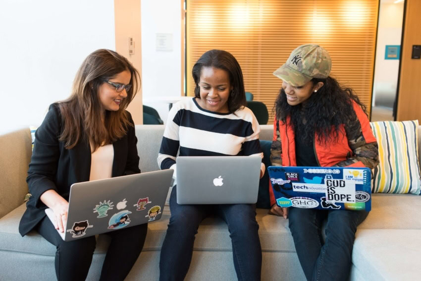 “Women in meeting practicing public speaking"