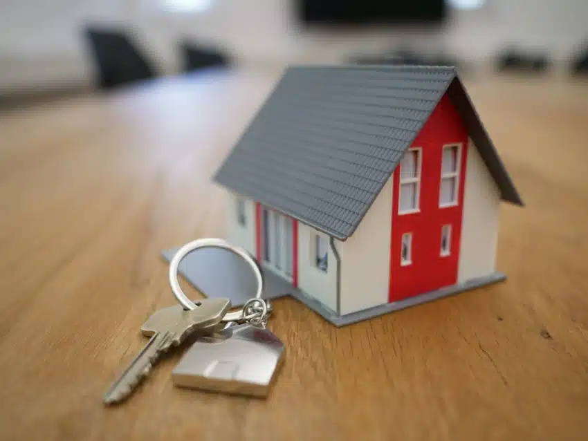 “Keys and house together on the table”
