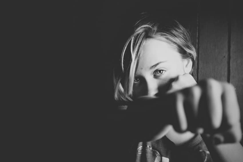 Child making fist towards the camera