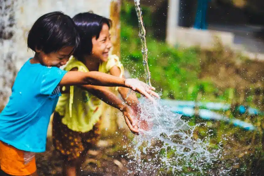 Two children playing in water