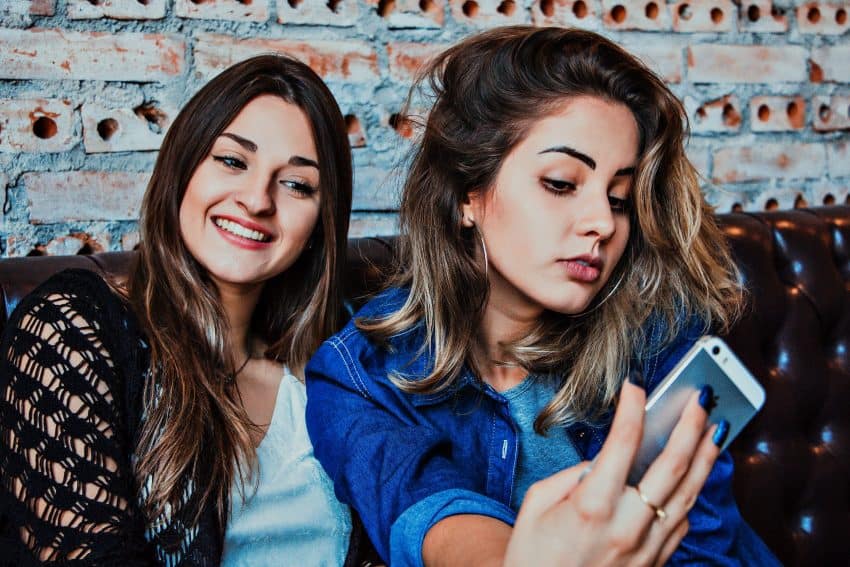 Two female University of the People students taking selfie