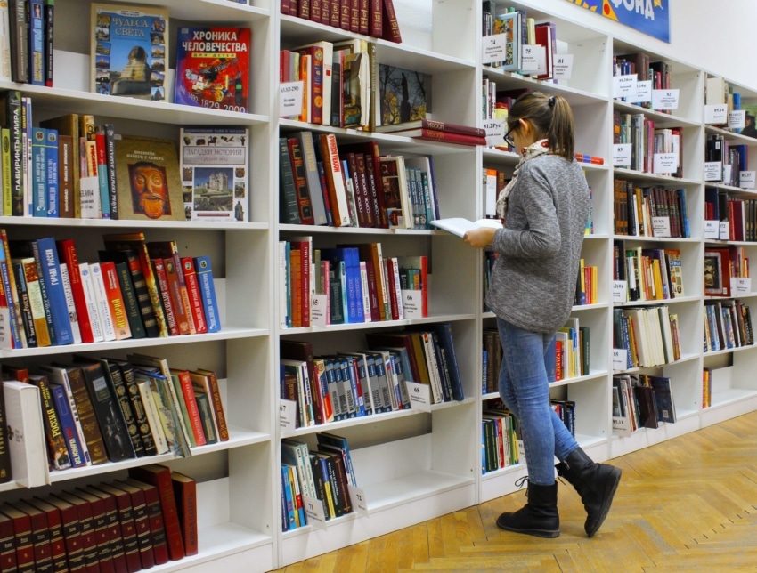 A student looking for a book in the library